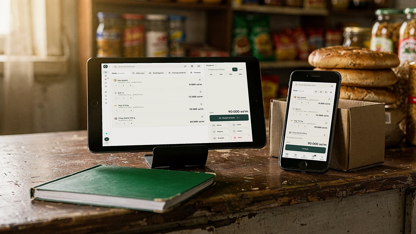 Clarapp till on a tablet and a phone on a shop counter